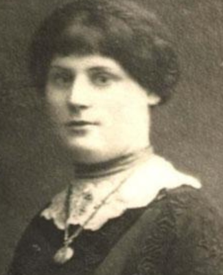 Woman with dark hair and lace collar, sepia photograph
